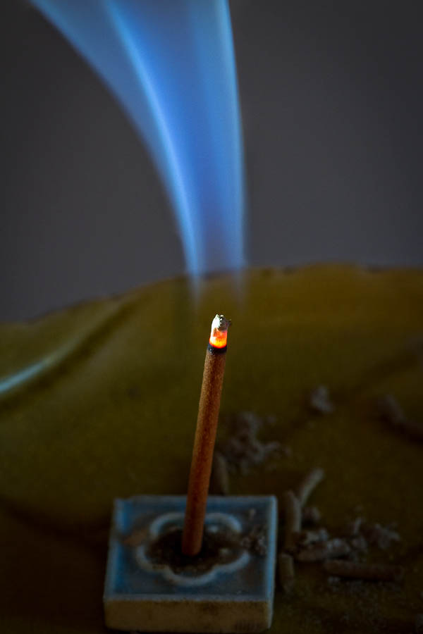 Burning sandalwood incense with smoke