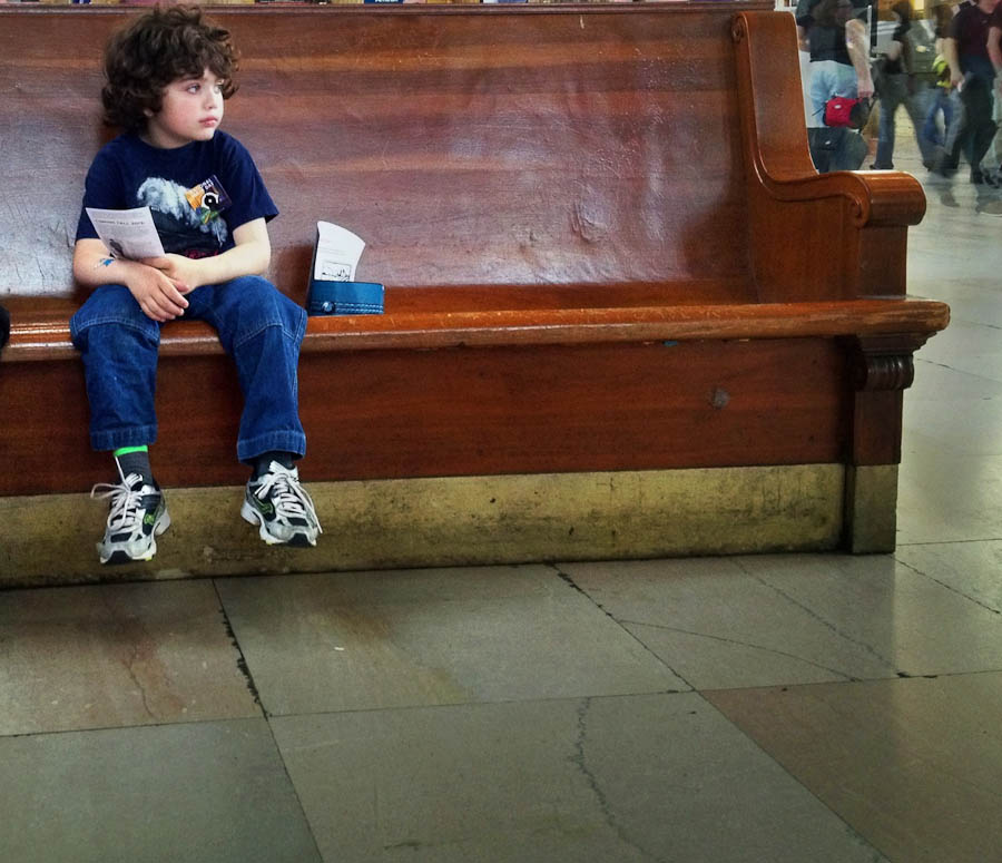 Box lunch and boy waiting for Amtrak train in station | Penn Station