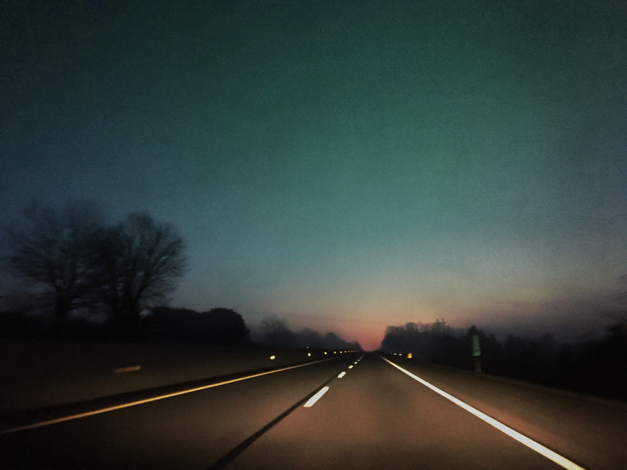 Foggy drive on the Pennsylvania turnpike watching the sunrise at the end of the road